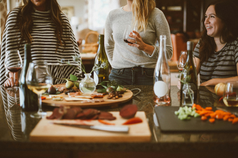 Three women having eating at a table